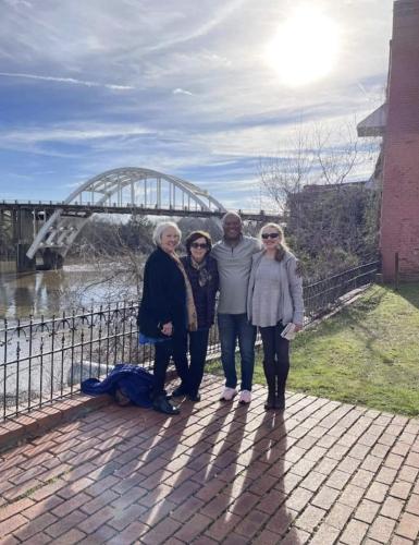 Posing near the St. James Hotel with Edmund Pettus Bridge in the distance